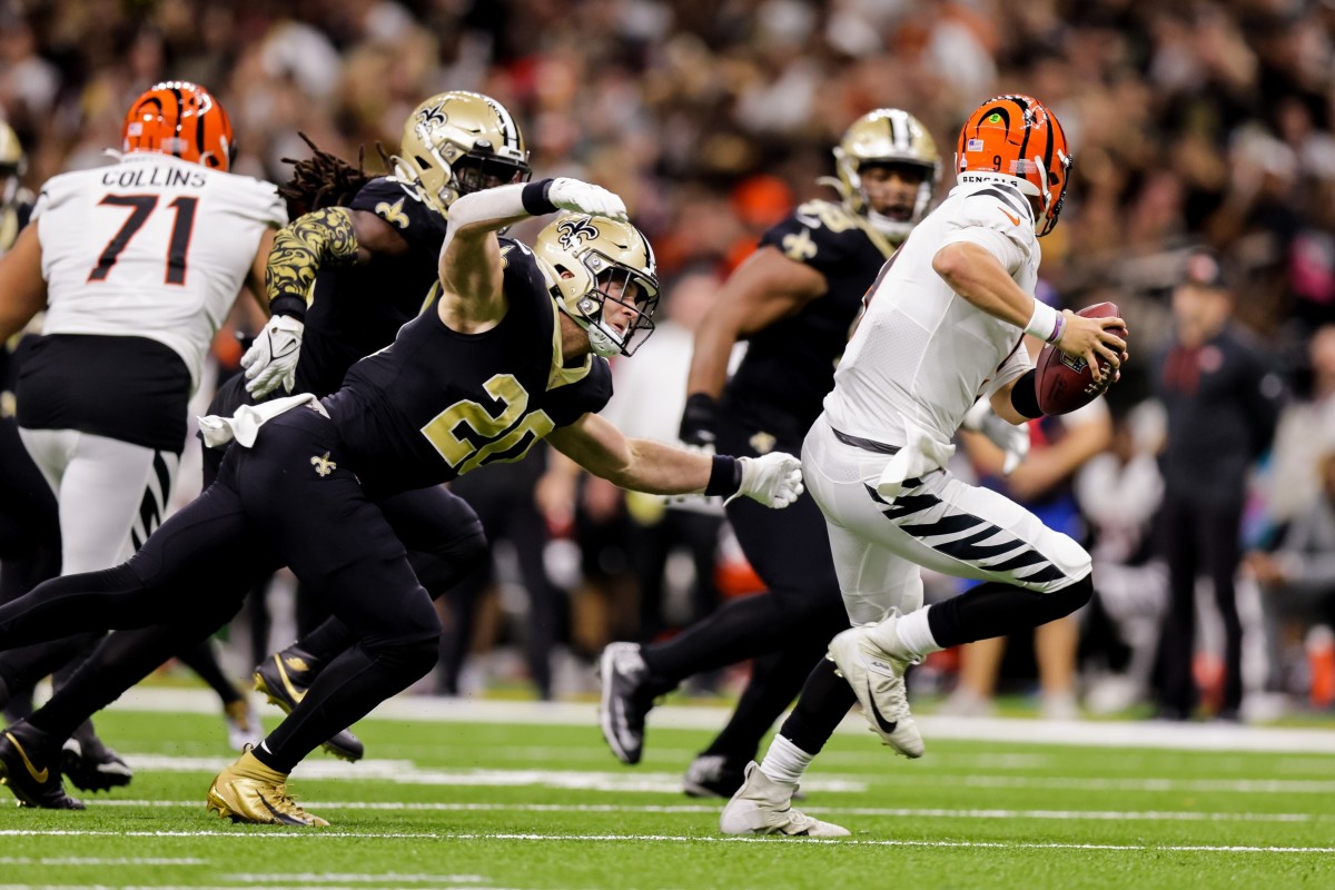 Cincinnati Bengals quarterback Joe Burrow (9) is pressured by New Orleans Saints linebacker Pete Werner (20). Mandatory Credit: Stephen Lew-USA TODAY Sports